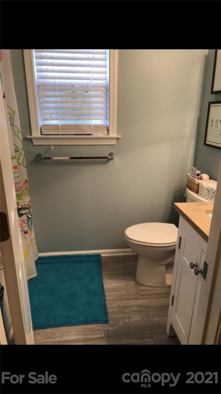 138 Yadkin Road, Unit 129 Fletcher, NC 28732 - Photo 11 of 37 a bathroom with a toilet and a sink