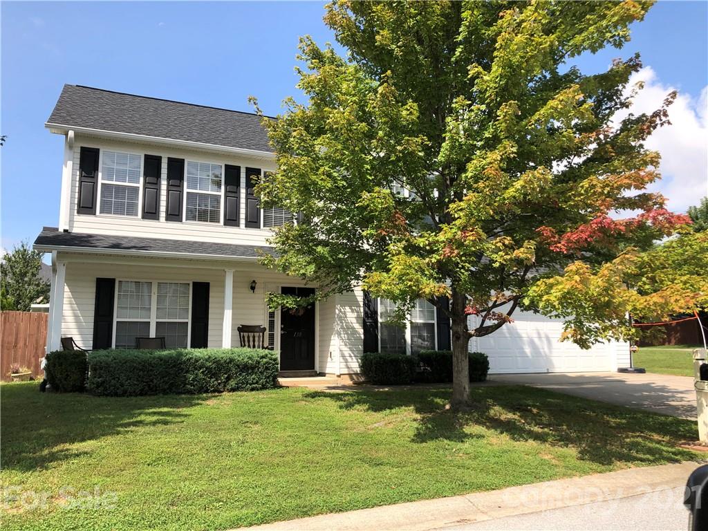 138 Yadkin Road, Unit 129 Fletcher, NC 28732 - Photo 19 of 37 a front view of a house with garden