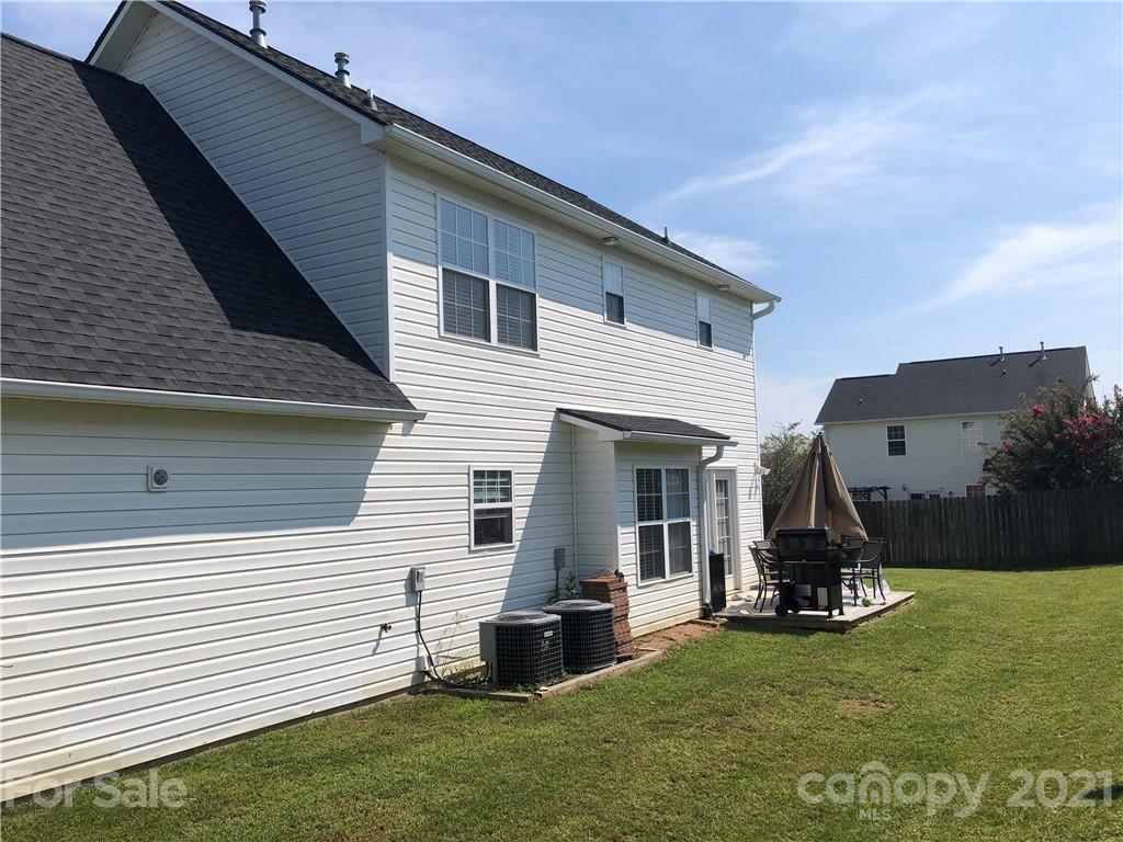 138 Yadkin Road, Unit 129 Fletcher, NC 28732 - Photo 24 of 37 a view of a patio with a table and chairs