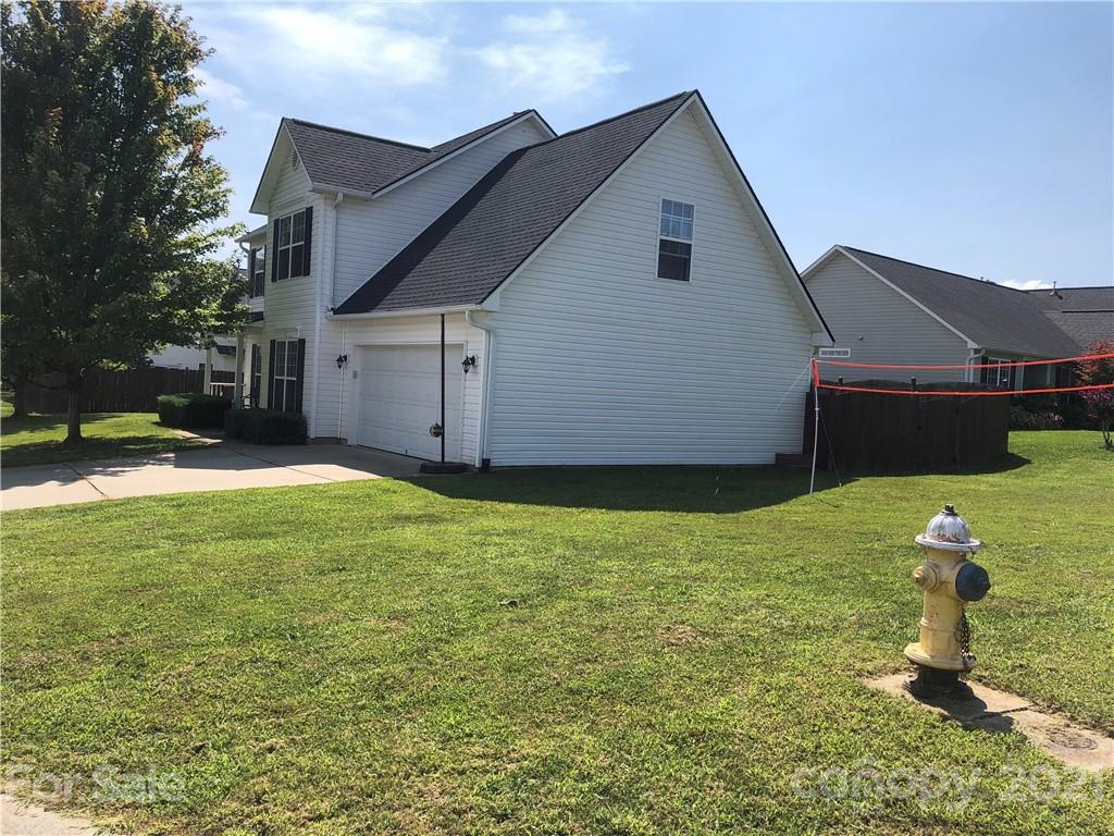 138 Yadkin Road, Unit 129 Fletcher, NC 28732 - Photo 25 of 37 a house view with a garden space