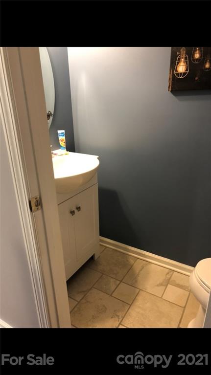 138 Yadkin Road, Unit 129 Fletcher, NC 28732 - Photo 10 of 37 a view of a bathroom with sink and mirror
