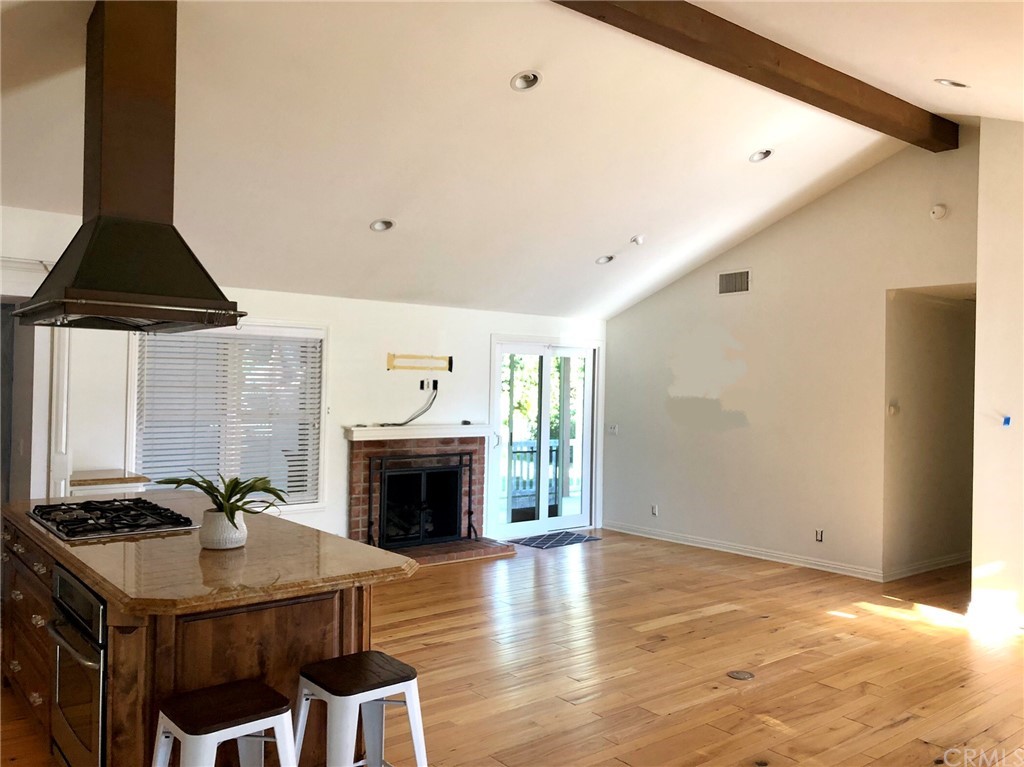 276 Esther Street Costa Mesa, CA 92627 - Photo 6 of 10 a living room with furniture and a fireplace