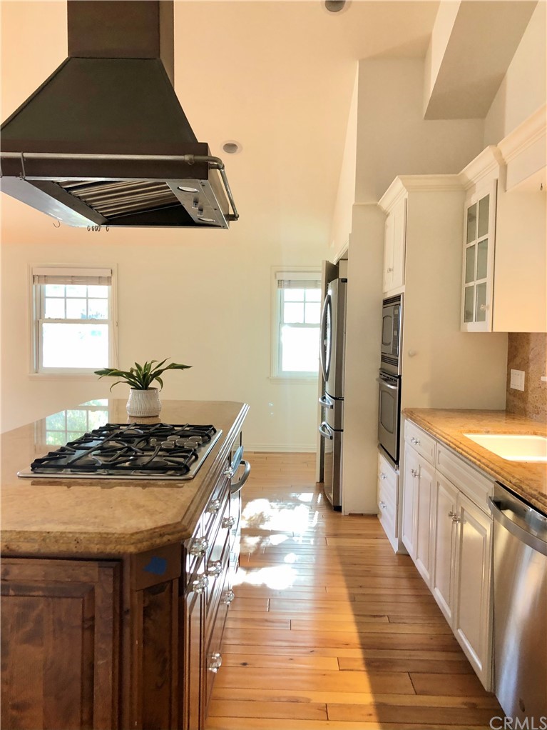 276 Esther Street Costa Mesa, CA 92627 - Photo 9 of 10 a kitchen that has a sink and a stove