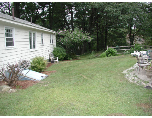 25 Rack Road Chelmsford, MA 01824 - Photo 8 of 8 a backyard of a house with seating space