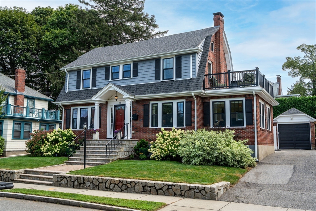30 Merrill Road Watertown, MA 02472 - Photo 1 of 35 a front view of a house with a yard