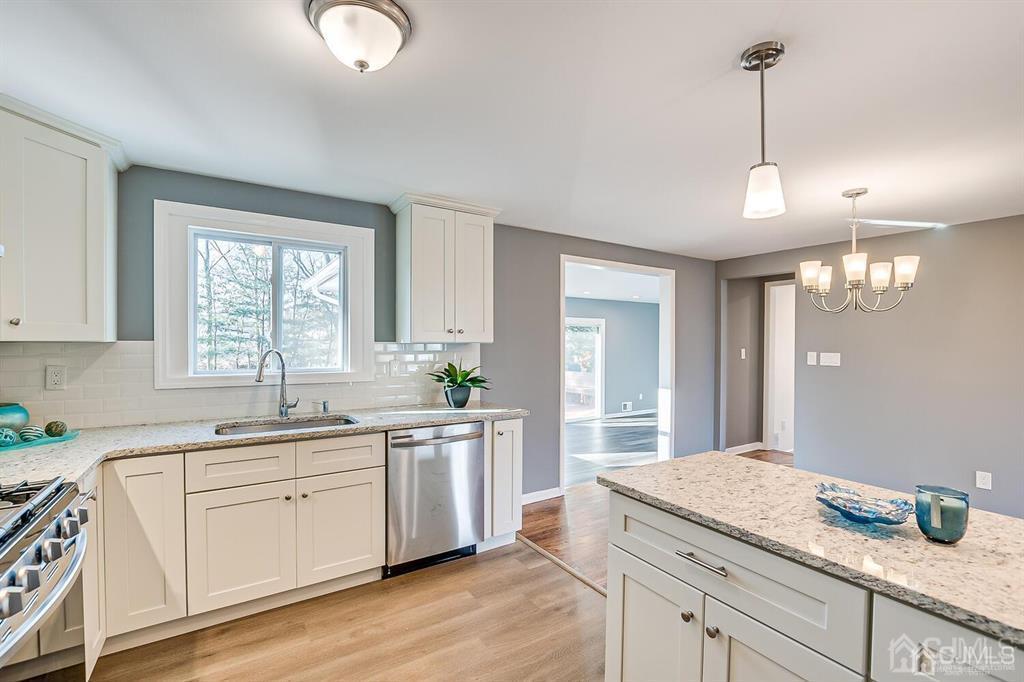 42 Norris Avenue Metuchen, NJ 08840 - Photo 15 of 39 a kitchen with white cabinets and sink