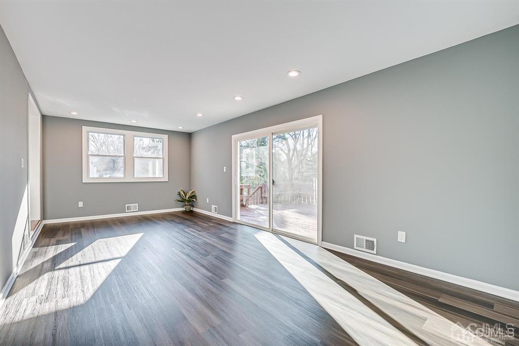 42 Norris Avenue Metuchen, NJ 08840 - Photo 18 of 39 an empty room with wooden floor and windows