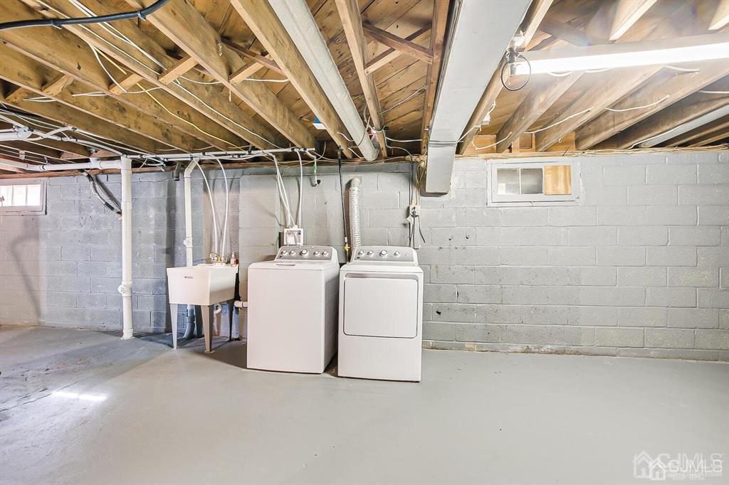 42 Norris Avenue Metuchen, NJ 08840 - Photo 30 of 39 a utility room with dryer and washer