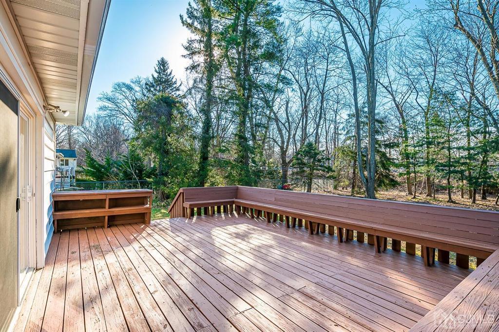 42 Norris Avenue Metuchen, NJ 08840 - Photo 32 of 39 a view of a roof deck with wooden floor and fence