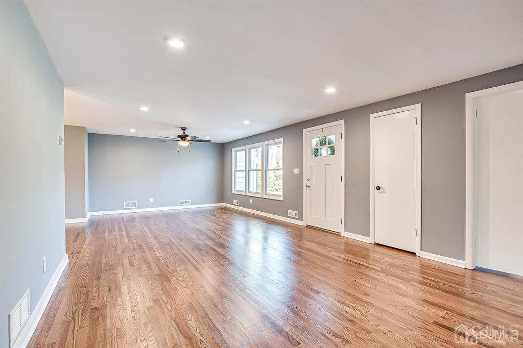 42 Norris Avenue Metuchen, NJ 08840 - Photo 8 of 39 a view of an empty room with wooden floor and a window