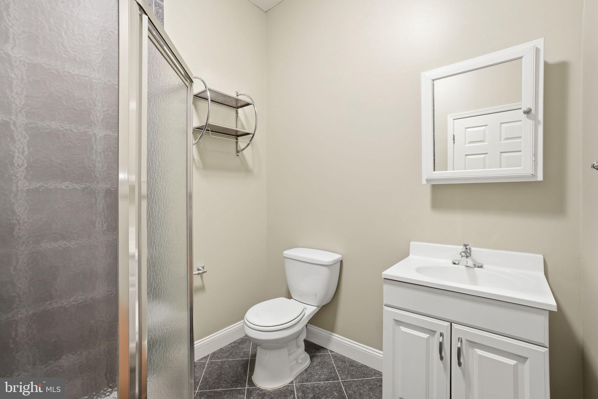 1440 Fairmont Street Northwest, Unit 3 Washington, DC 20009 - Photo 14 of 21 a bathroom with a toilet sink and vanity