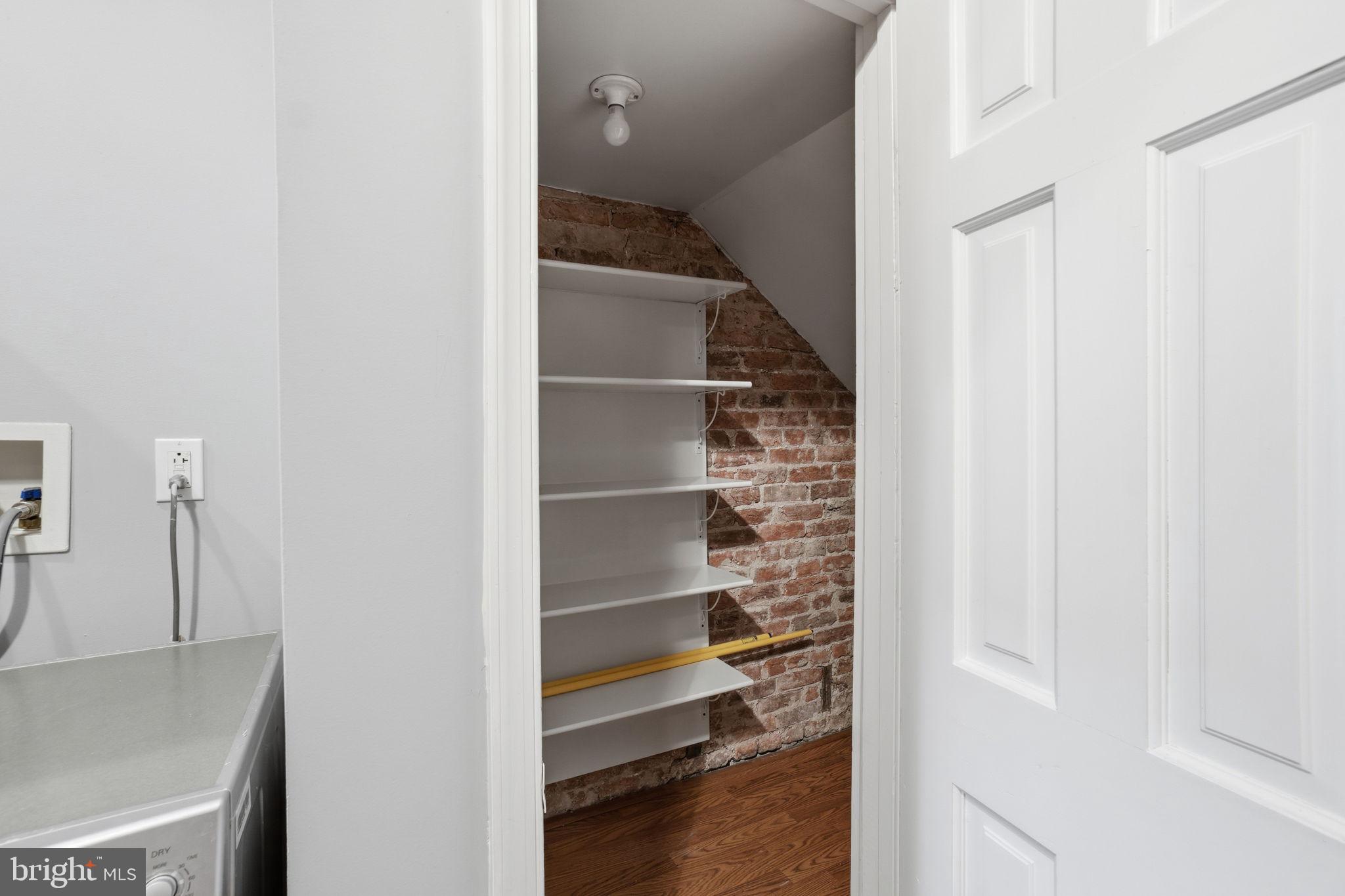 1440 Fairmont Street Northwest, Unit 3 Washington, DC 20009 - Photo 17 of 21 a view of a hallway with closet and wooden floor