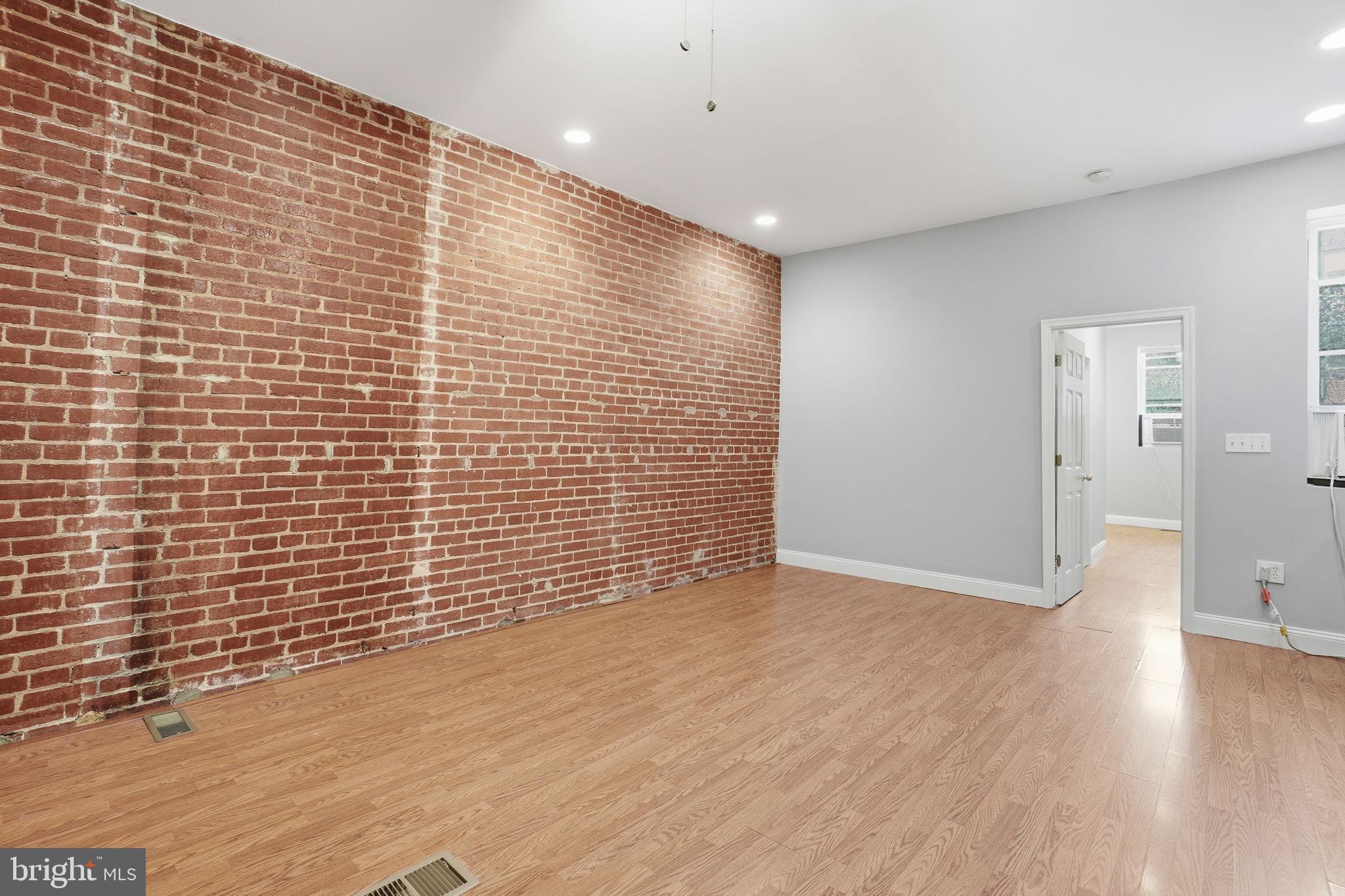 1440 Fairmont Street Northwest, Unit 3 Washington, DC 20009 - Photo 8 of 21 a view of an empty room with wooden floor