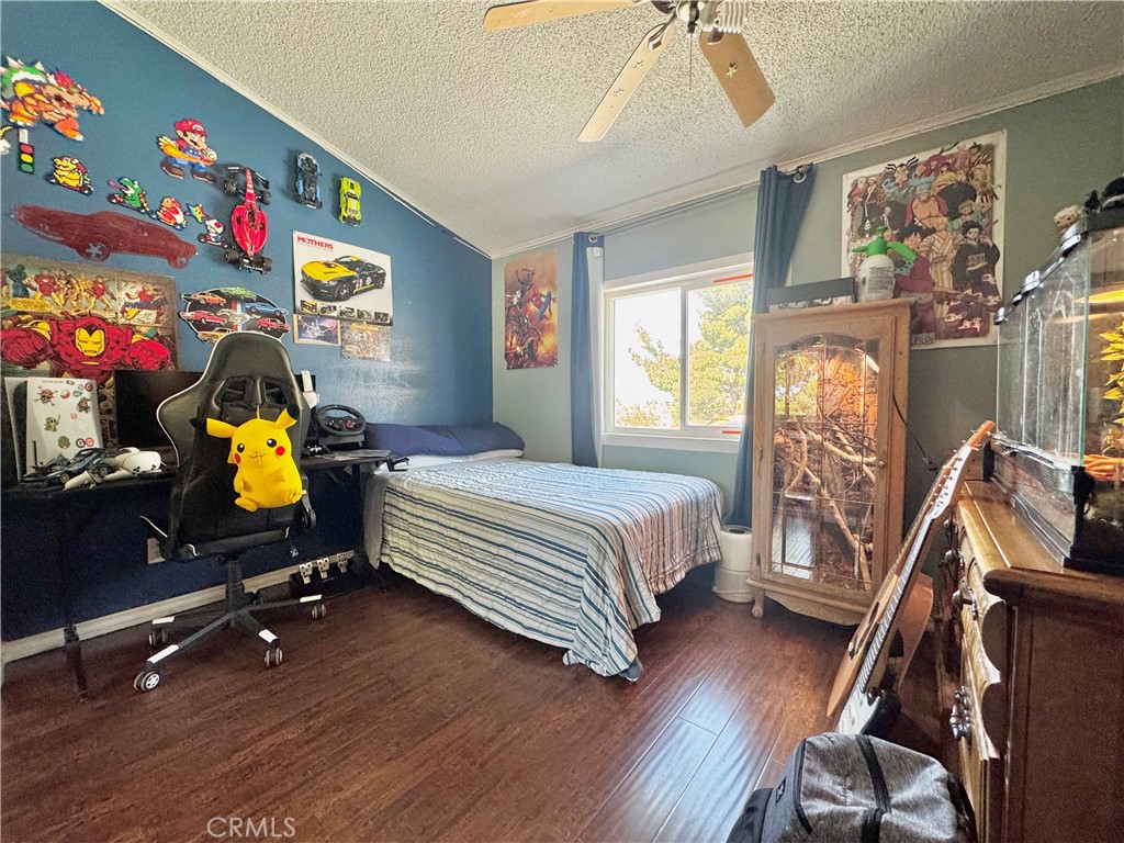 2775 Duncan Road Phelan, CA 92371 - Photo 12 of 29 a bedroom with bed and wooden floor
