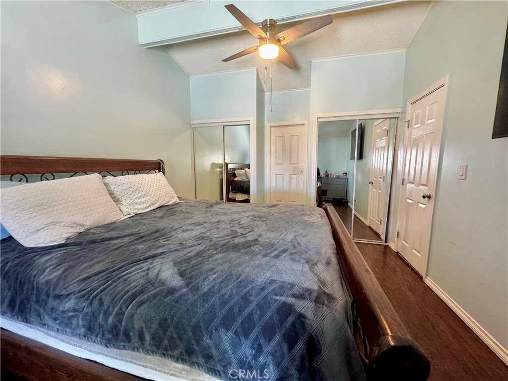 2775 Duncan Road Phelan, CA 92371 - Photo 8 of 29 a bedroom with a bed and a chandelier