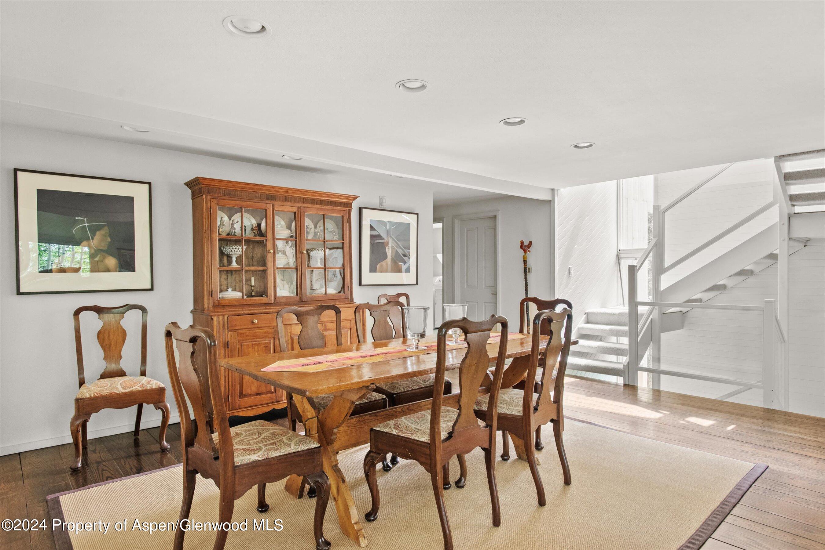 209 Larkspur Lane Aspen, CO 81611 - Photo 16 of 45 a dining room with furniture and window