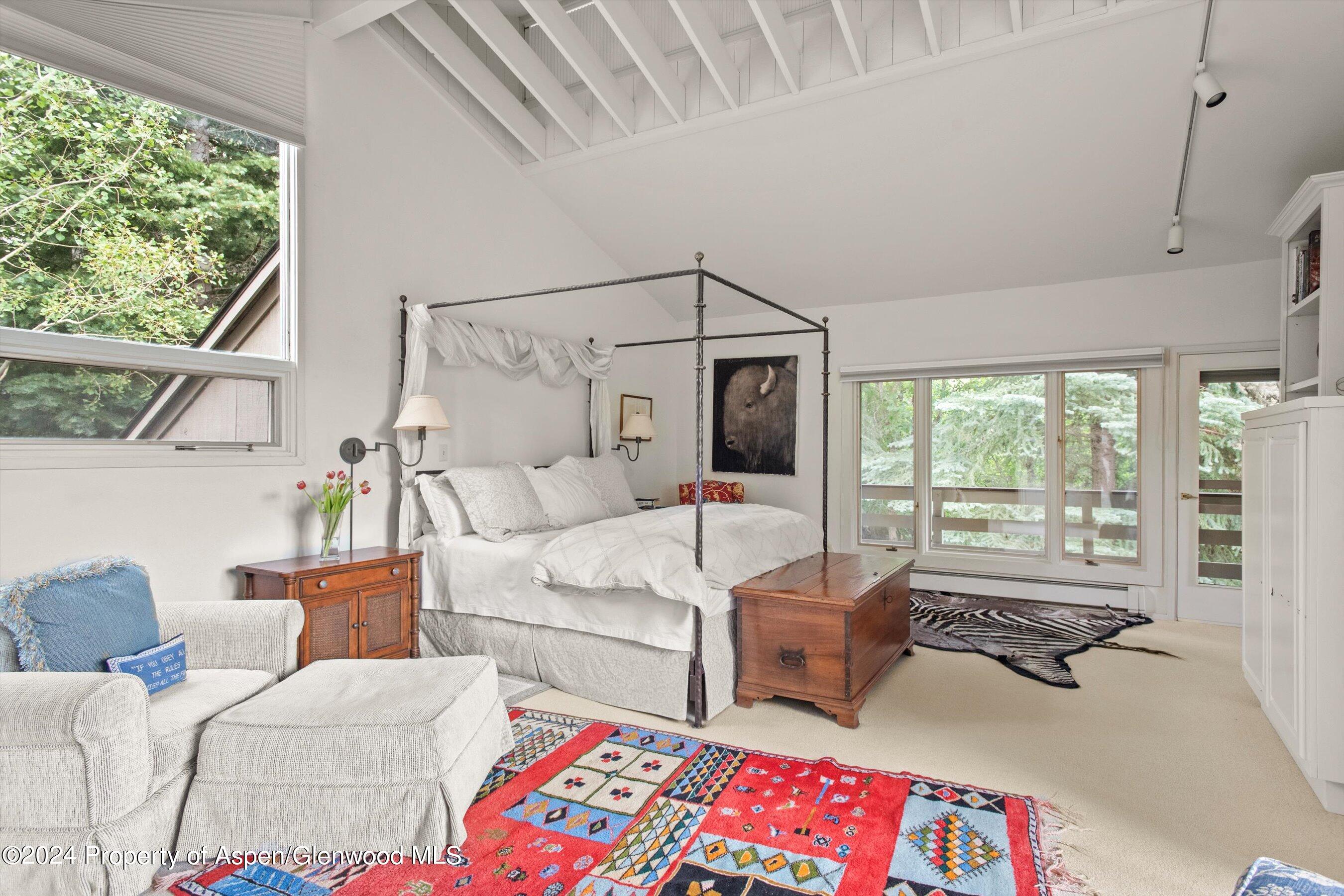 209 Larkspur Lane Aspen, CO 81611 - Photo 23 of 45 a living room with furniture and a large window