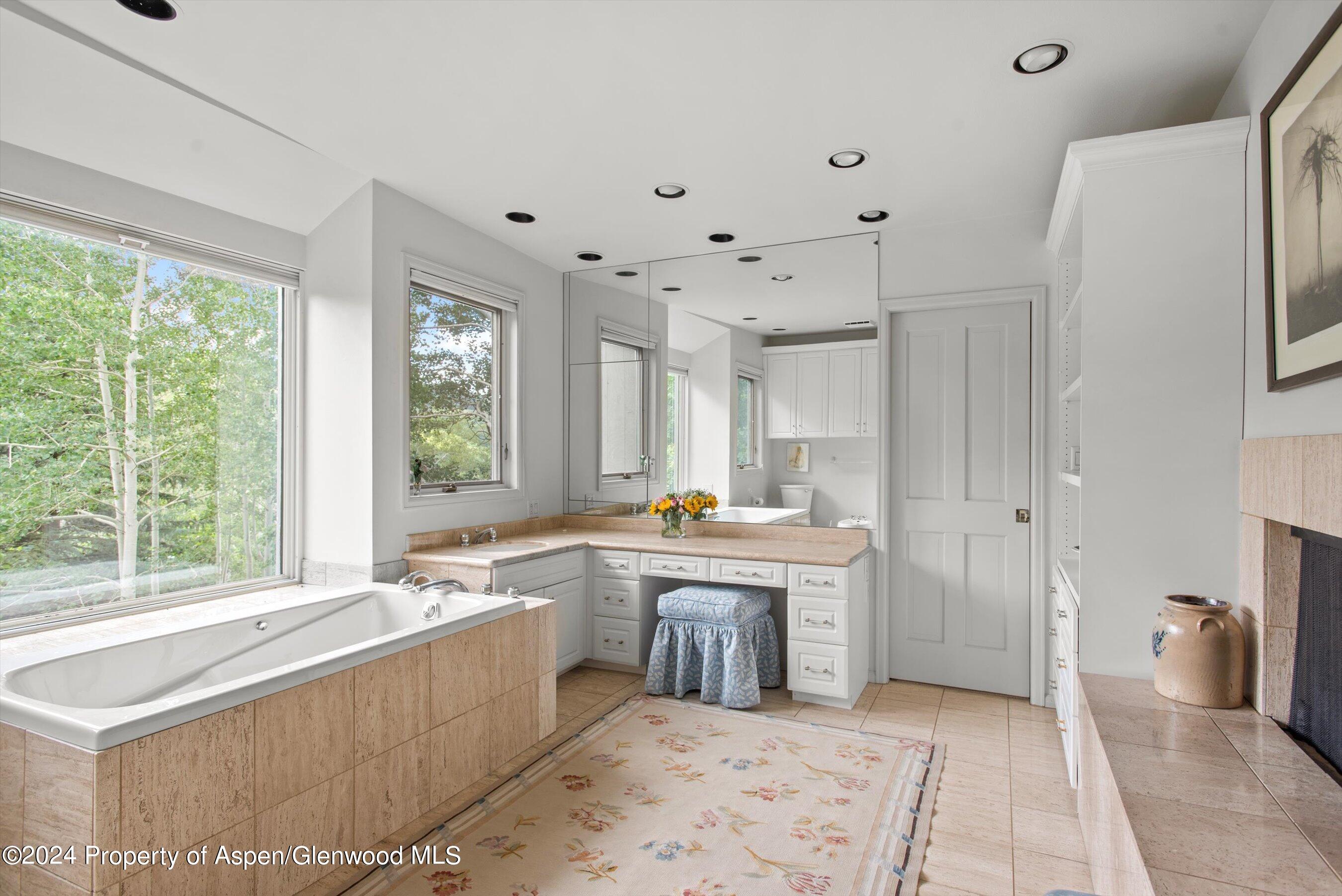 209 Larkspur Lane Aspen, CO 81611 - Photo 25 of 45 a kitchen with a sink stove and cabinets