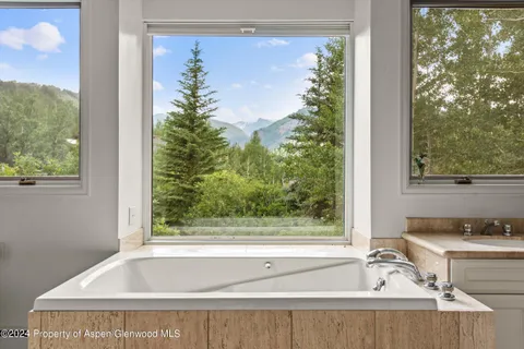 a bathroom with a bathtub and a sink