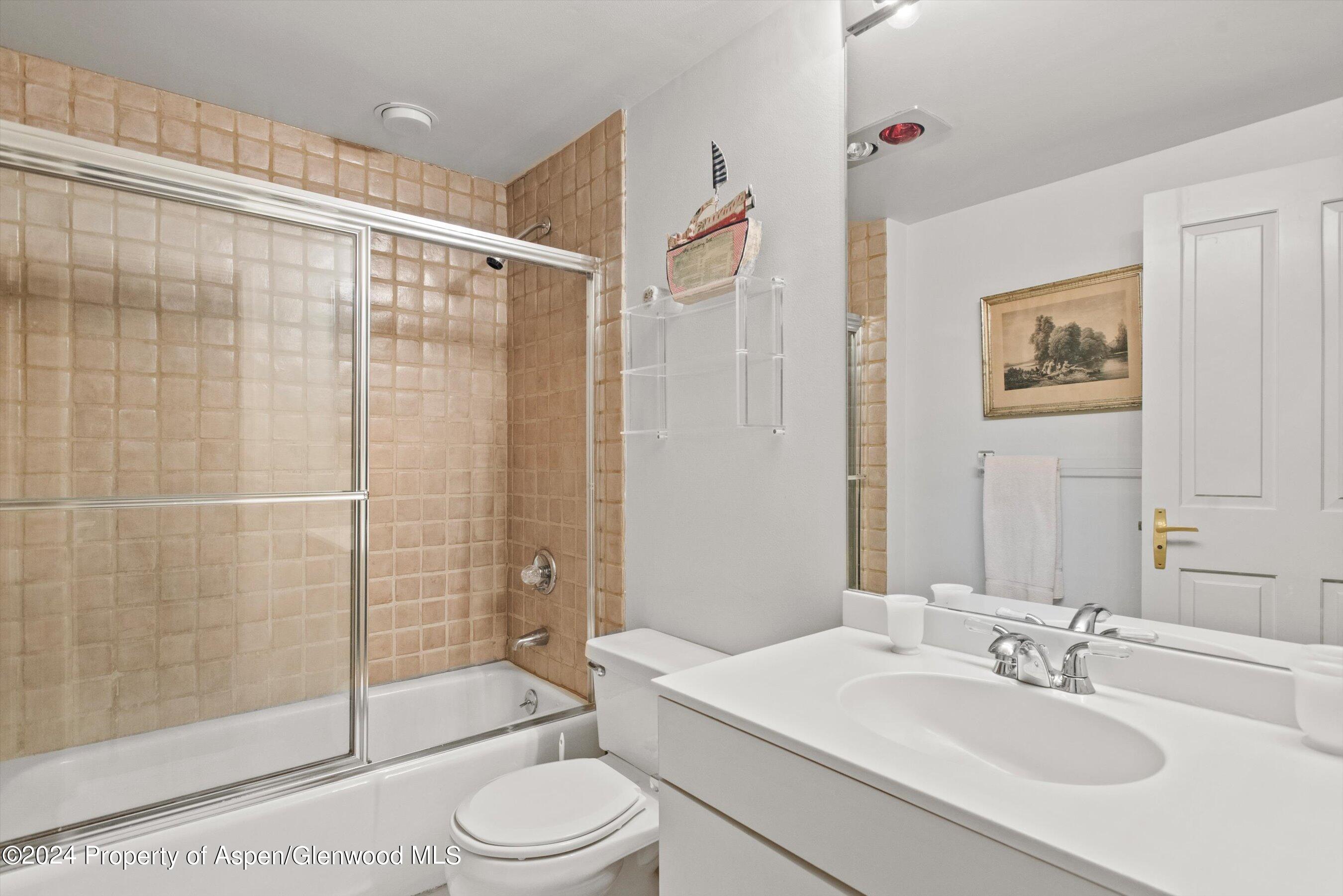 209 Larkspur Lane Aspen, CO 81611 - Photo 31 of 45 a bathroom with a sink toilet and shower