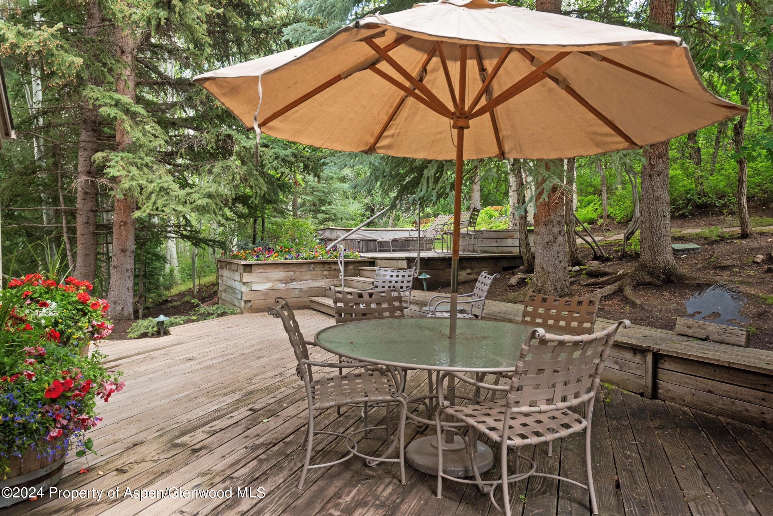 209 Larkspur Lane Aspen, CO 81611 - Photo 42 of 45 a patio with a patio table and chairs