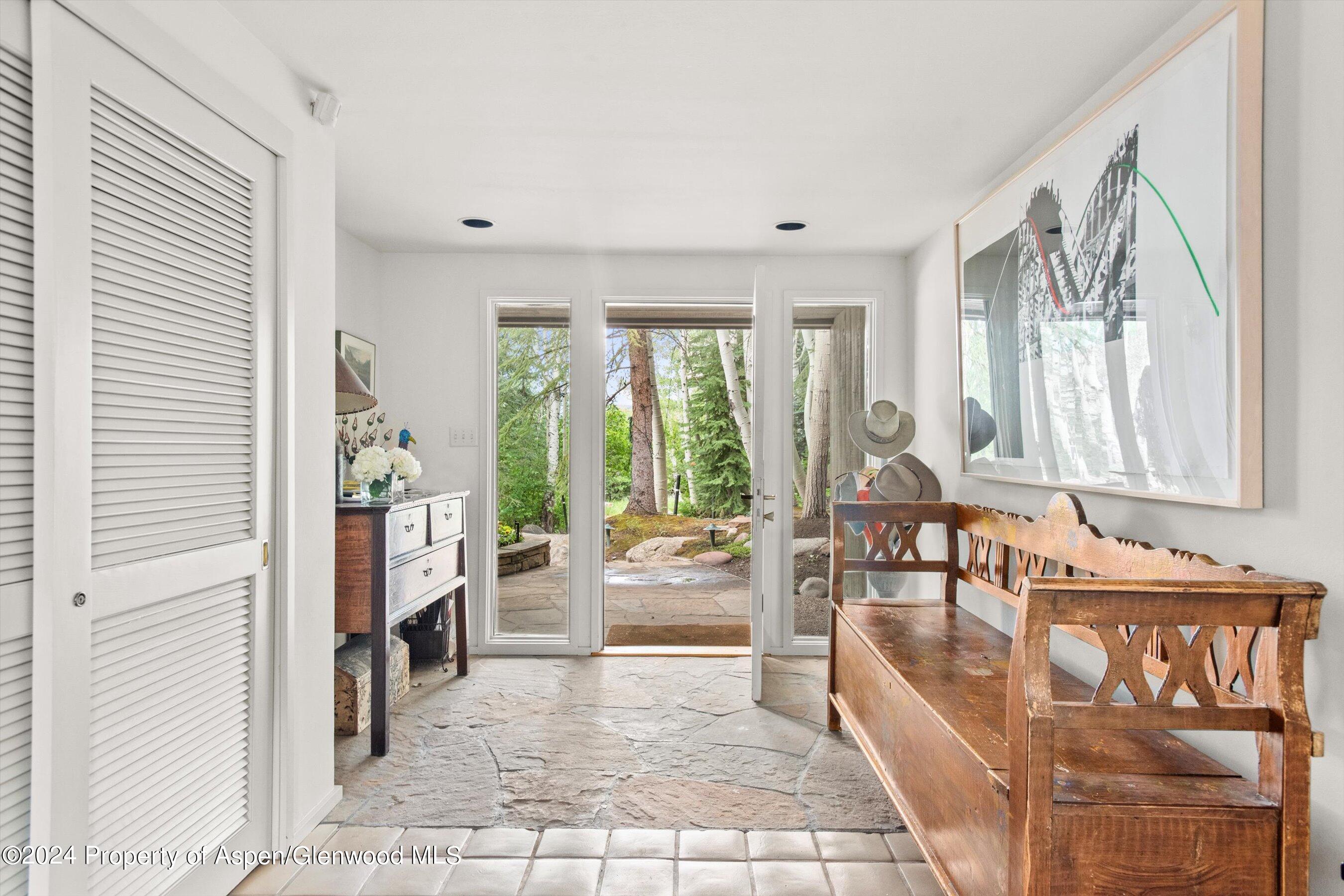 209 Larkspur Lane Aspen, CO 81611 - Photo 6 of 45 a living room with furniture and large windows