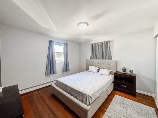 a bedroom with a bed and a table