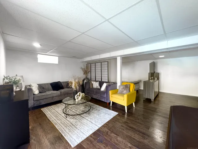 a bed room with a bed and a television