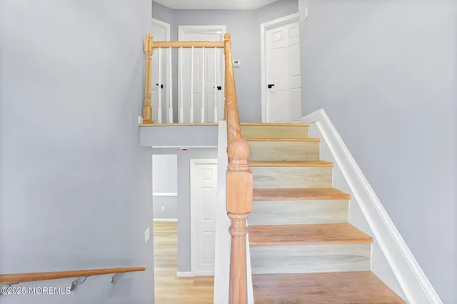 a view of staircase with white walls