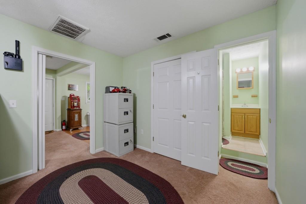 542 Knox Chapel Road Social Circle, GA 30025 - Photo 30 of 52 a bedroom with a bed and a closet