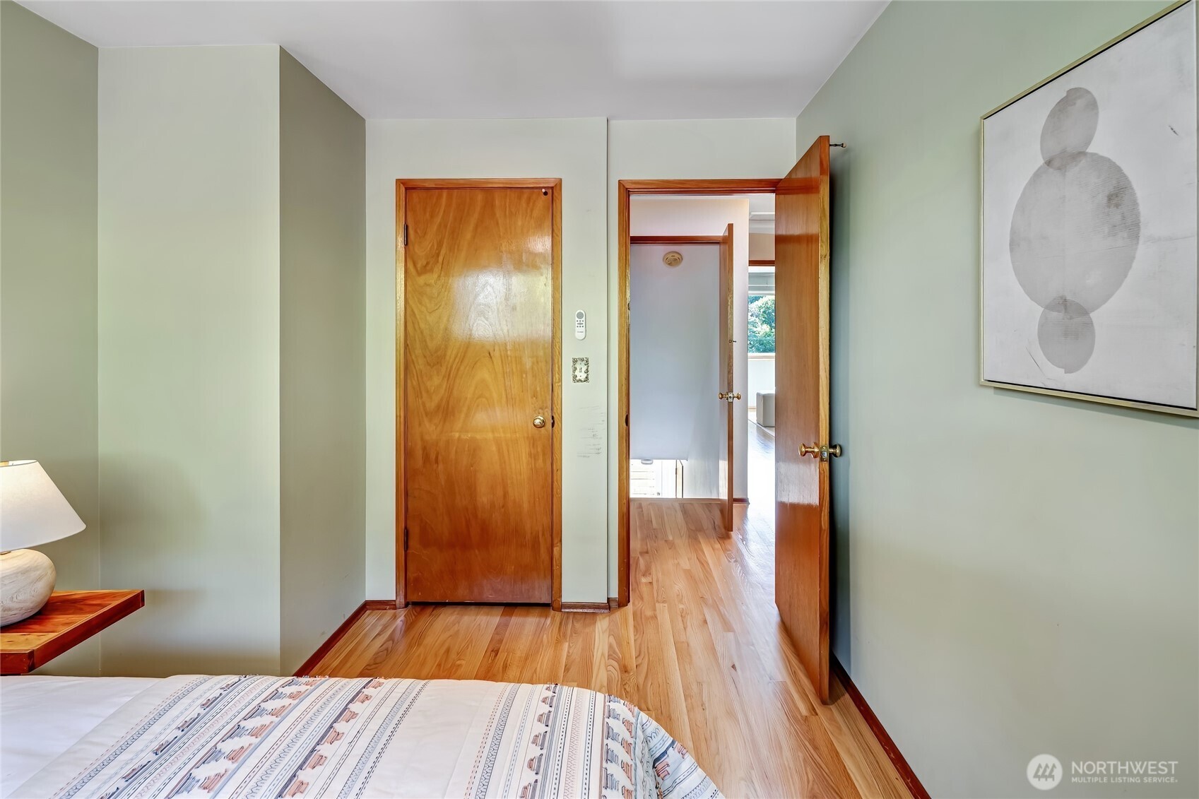 7571 45th Avenue Southwest Seattle, WA 98136 - Photo 22 of 40 a view of a hallway with wooden floor and bathroom