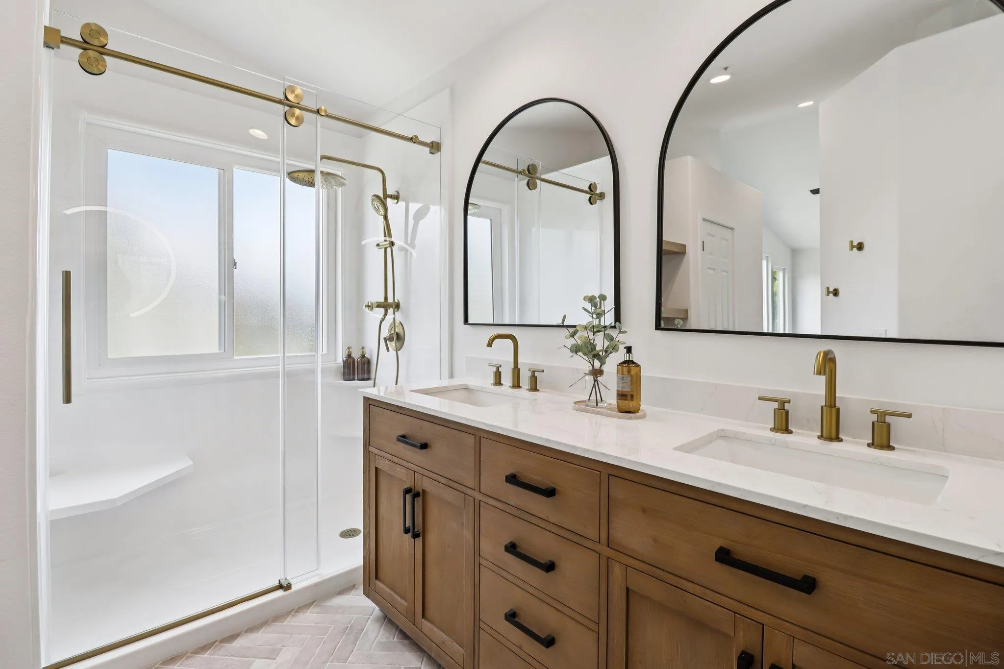 2082 Fairhope Loop Vista, CA 92081 - Photo 12 of 27 a spacious bathroom with a granite countertop sink mirror and double