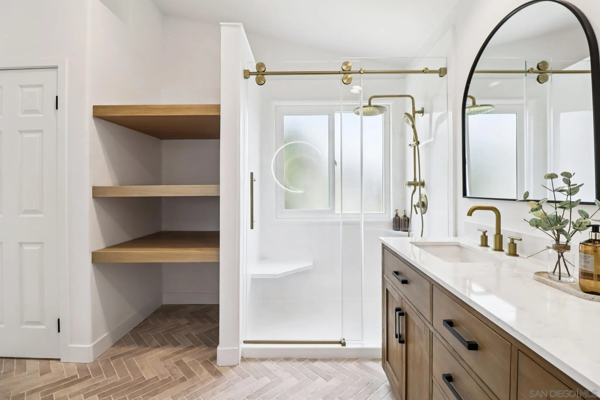2082 Fairhope Loop Vista, CA 92081 - Photo 13 of 27 a bathroom with a double vanity sink mirror and