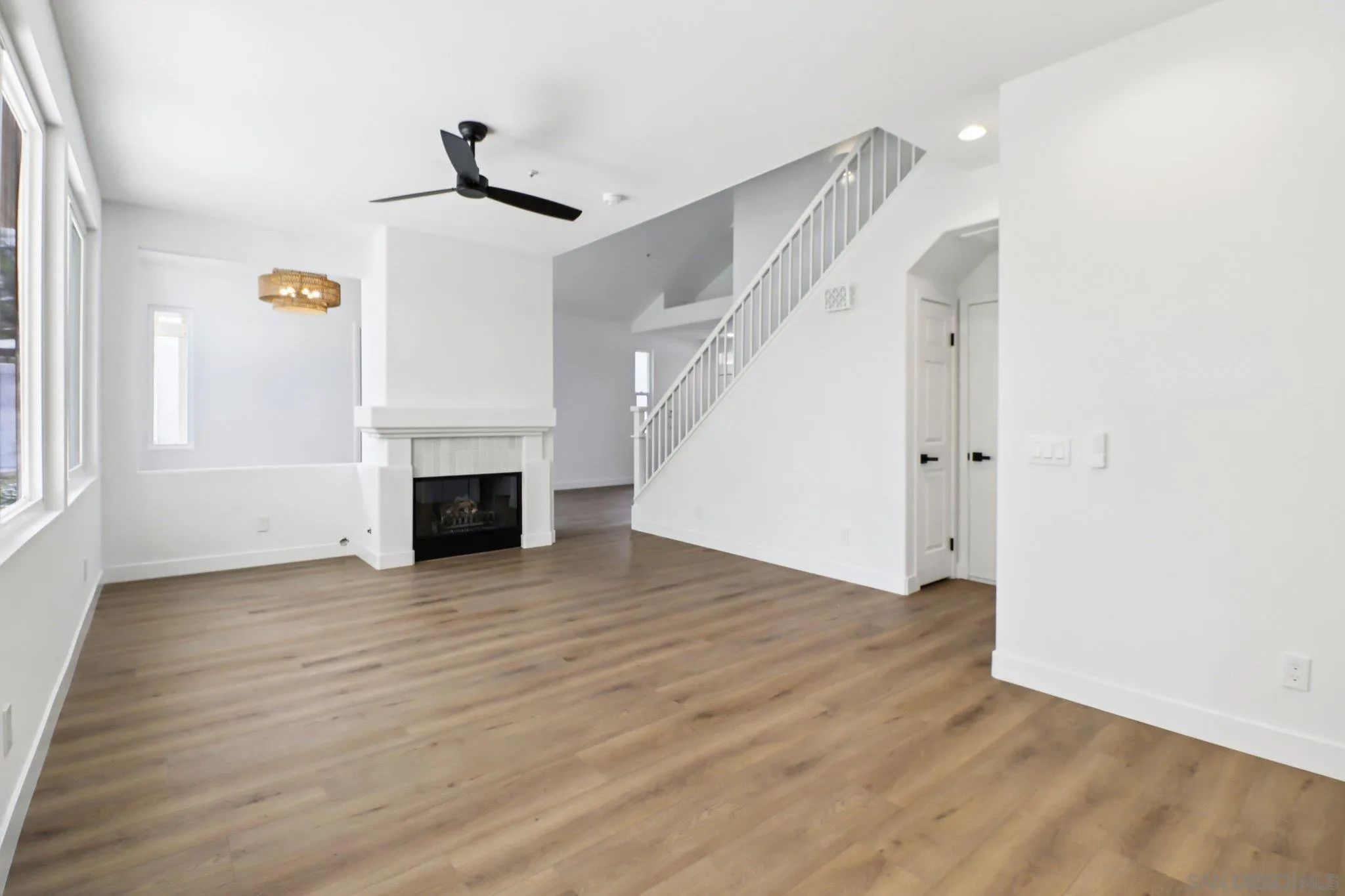 2082 Fairhope Loop Vista, CA 92081 - Photo 3 of 27 a view of empty room with wooden floor and fireplace
