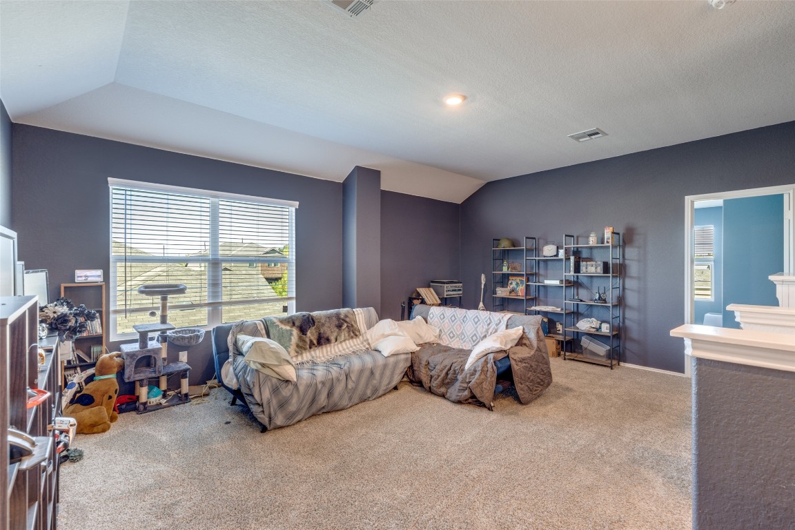 207 Otter Road Kyle, TX 78640 - Photo 16 of 26 a living room with furniture and a large window