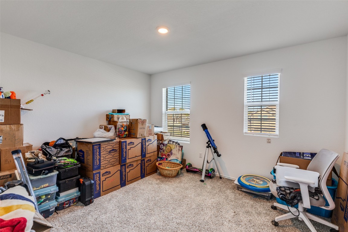 207 Otter Road Kyle, TX 78640 - Photo 21 of 26 a view of a room with gym equipment