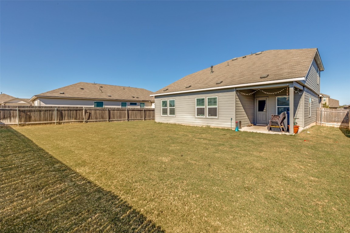 207 Otter Road Kyle, TX 78640 - Photo 23 of 26 a front view of a house with garden