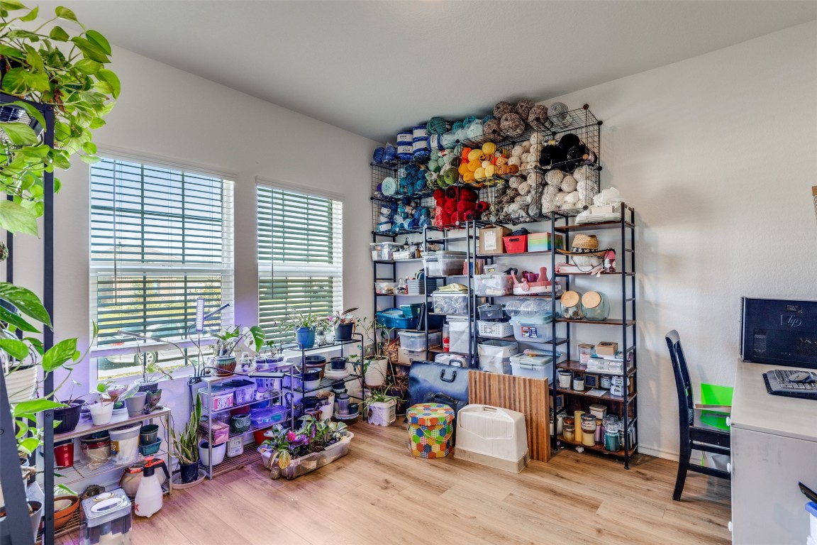 207 Otter Road Kyle, TX 78640 - Photo 3 of 26 a room with toys and a potted plant