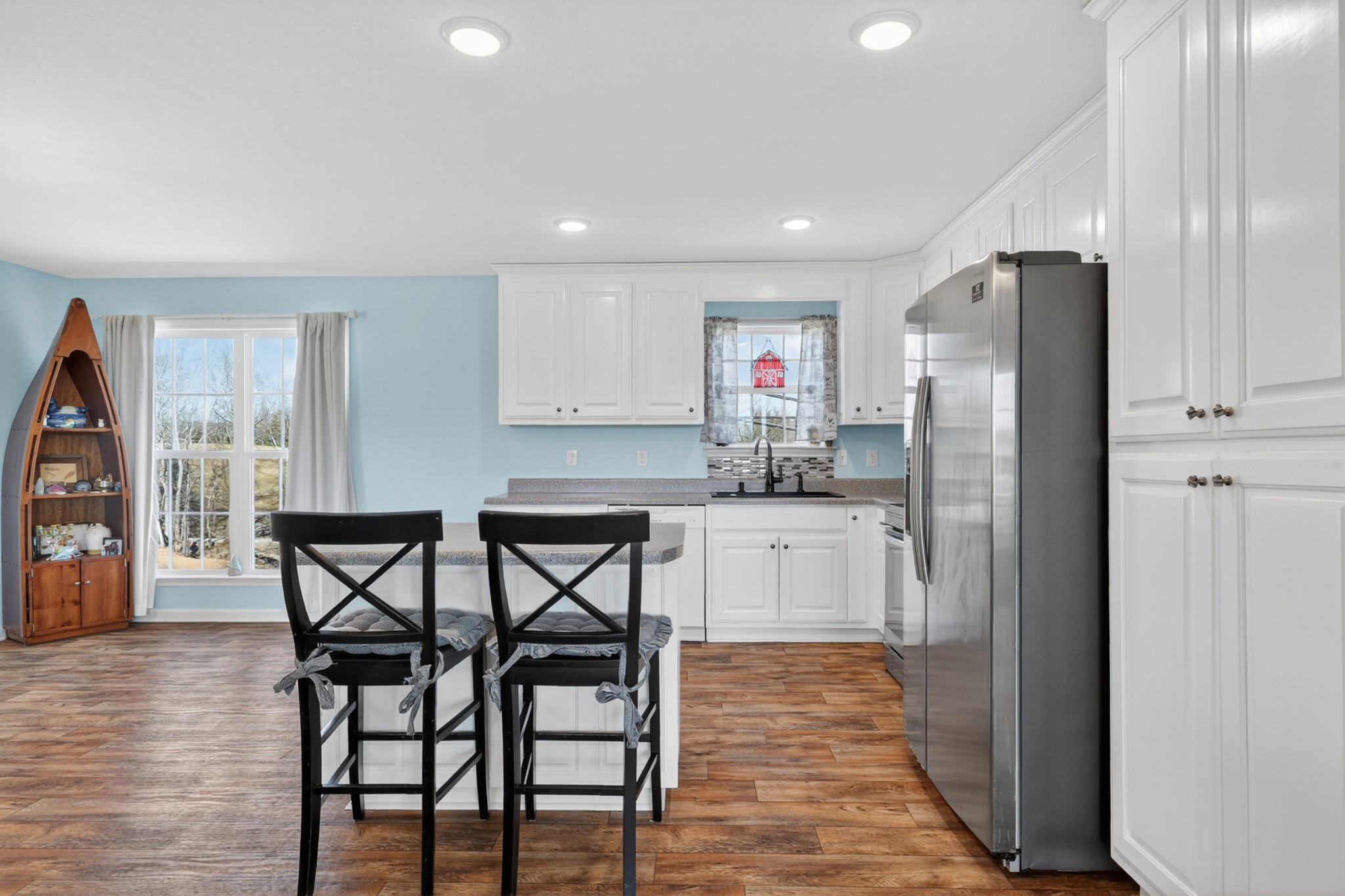 198 L Mitchell Road Flintville, TN 37335 - Photo 11 of 41 a kitchen with stainless steel appliances a refrigerator a table and chairs