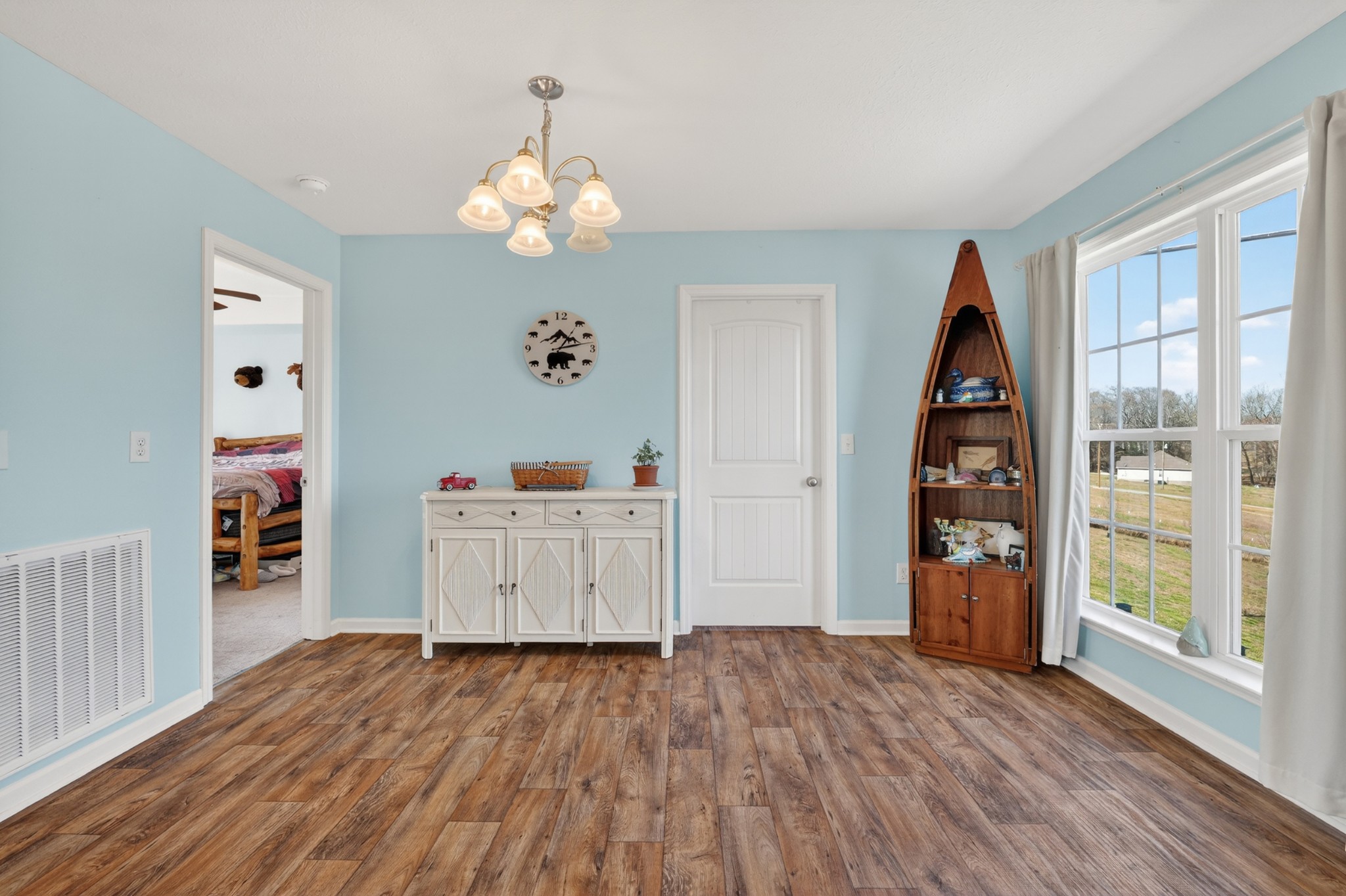 198 L Mitchell Road Flintville, TN 37335 - Photo 14 of 41 a view of a bedroom with wooden floor and windows
