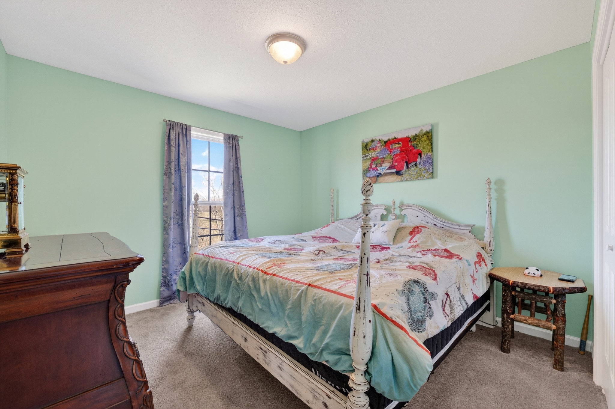 198 L Mitchell Road Flintville, TN 37335 - Photo 17 of 41 a bedroom with a bed and a table