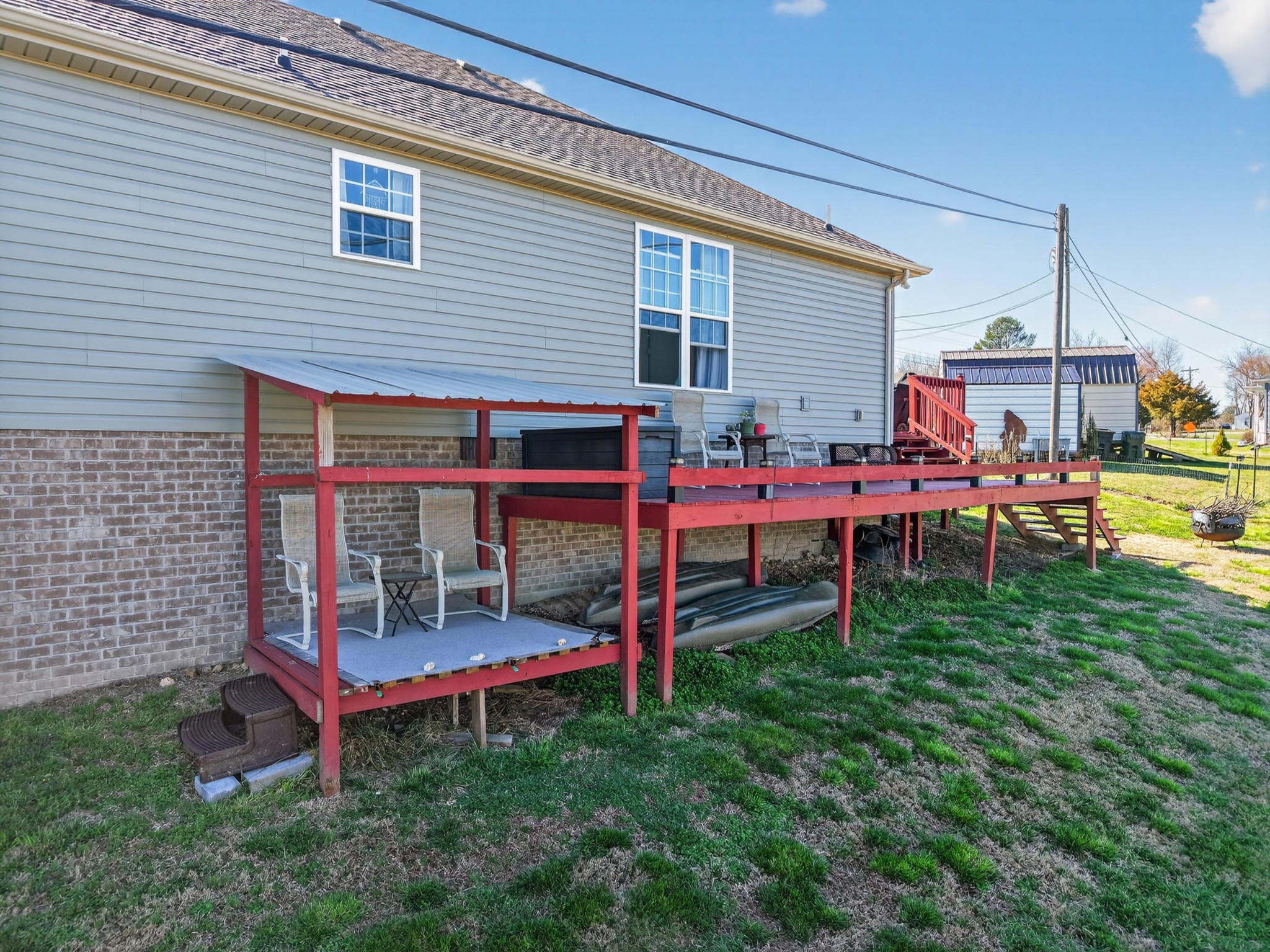 198 L Mitchell Road Flintville, TN 37335 - Photo 27 of 41 a backyard of a house with table and chairs