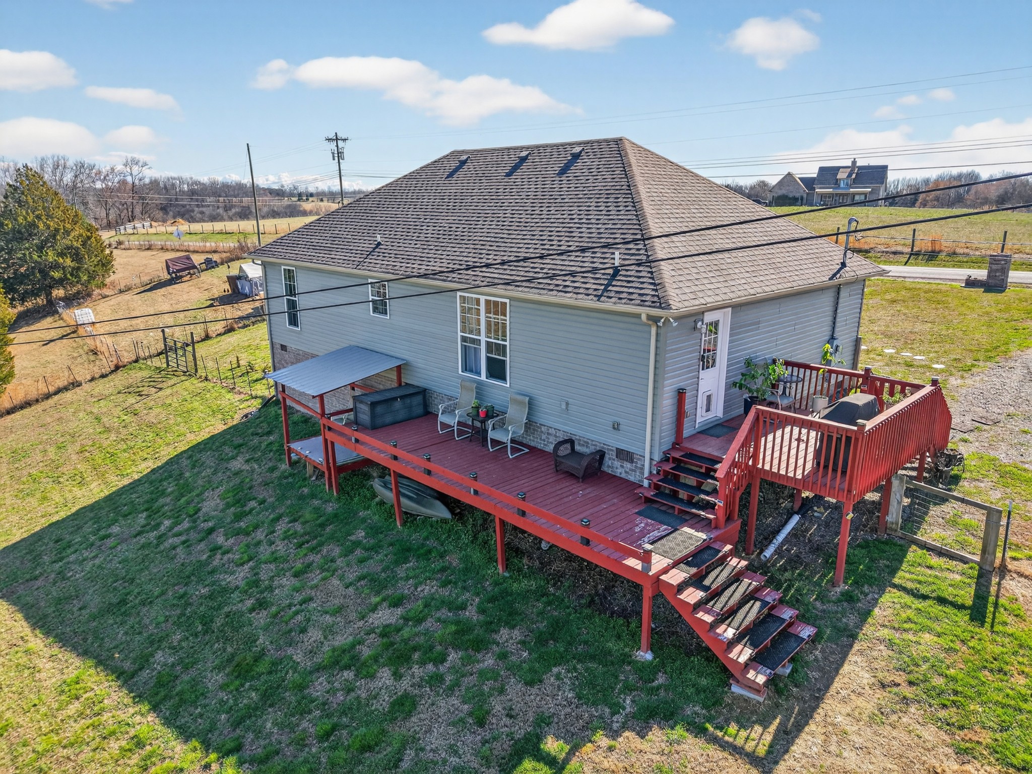 198 L Mitchell Road Flintville, TN 37335 - Photo 28 of 41 a aerial view of a house with table and chairs and a yard