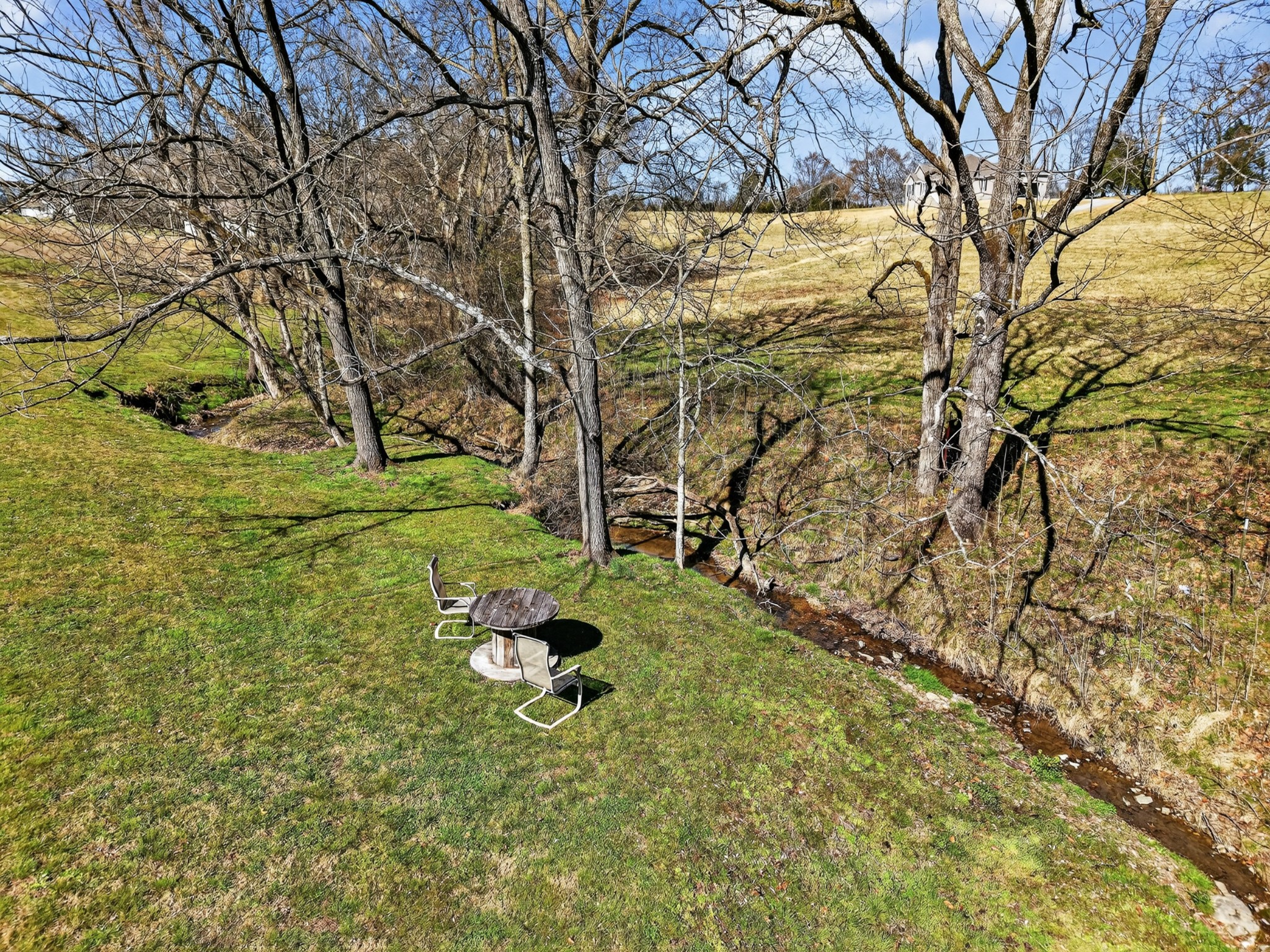 198 L Mitchell Road Flintville, TN 37335 - Photo 31 of 41 a backyard of a house with table and chairs