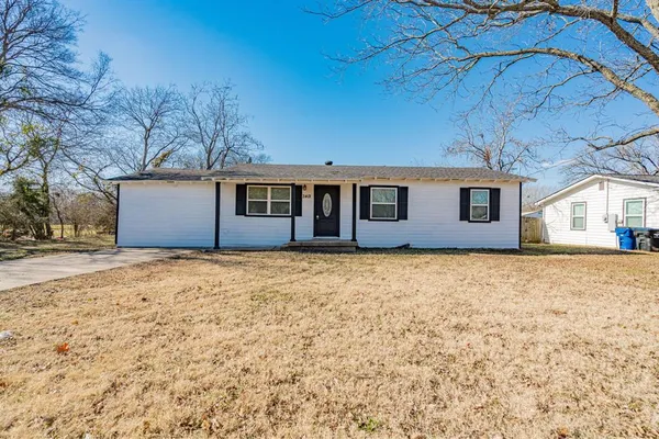 a house with trees in front of it