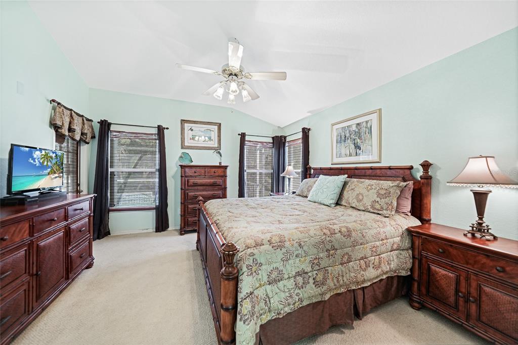 425 Islamorada Boulevard Punta Gorda, FL 33955 - Photo 15 of 44 a bedroom with a bed and a flat screen tv