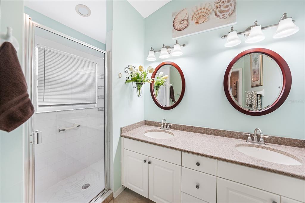 425 Islamorada Boulevard Punta Gorda, FL 33955 - Photo 16 of 44 a bathroom with a sink and a mirror