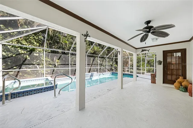 a view of a livingroom with a furniture and floor to ceiling window