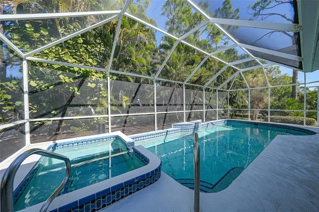 a view of swimming pool with seating area