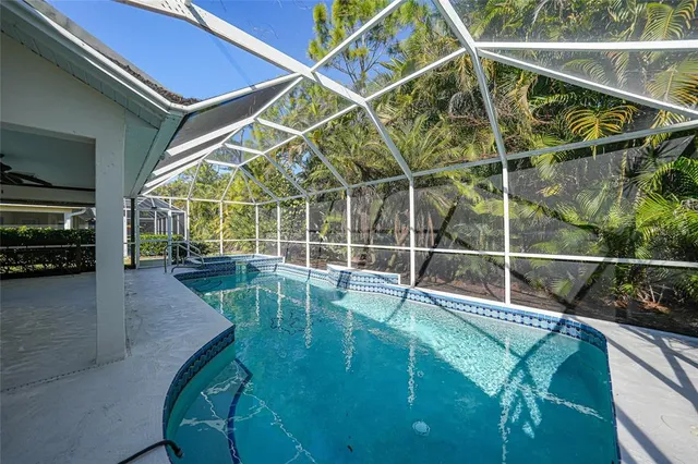 a view of a swimming pool with a patio